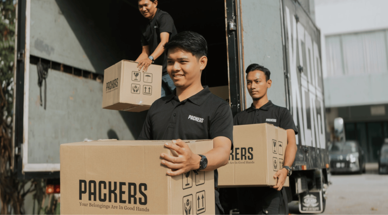 Image of Packers Xpress movers team handling boxes for moving service in KL